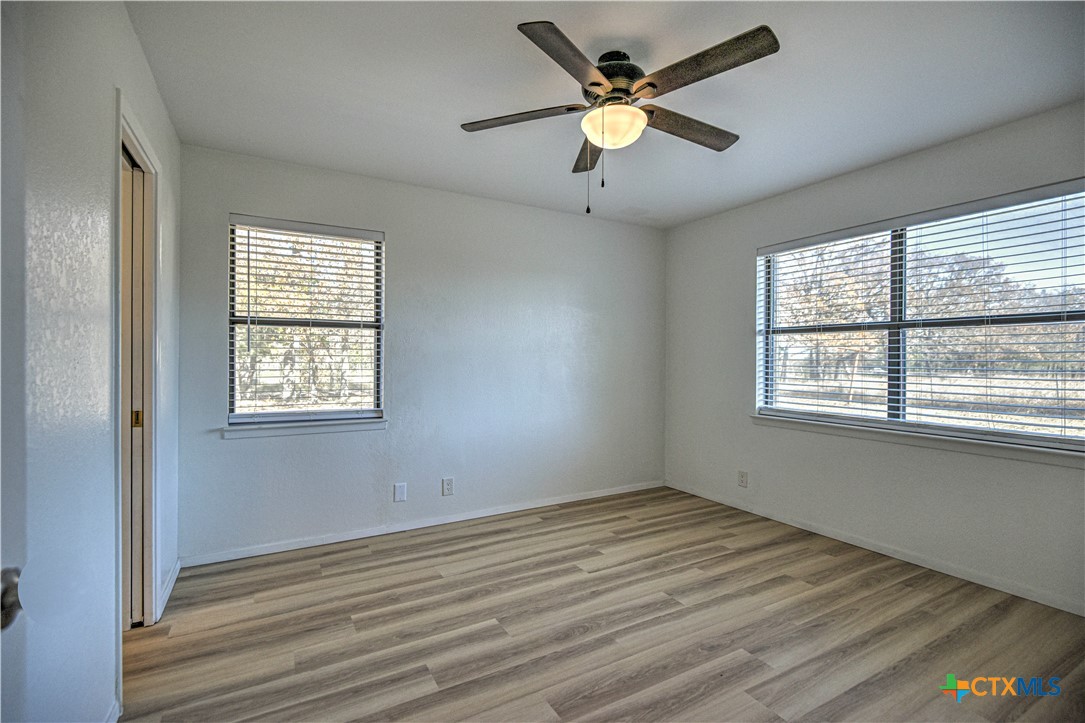 8510 Burgandy Lane Temple, TX 76504 - Photo 22 of 48 wooden floor in an empty room with a window