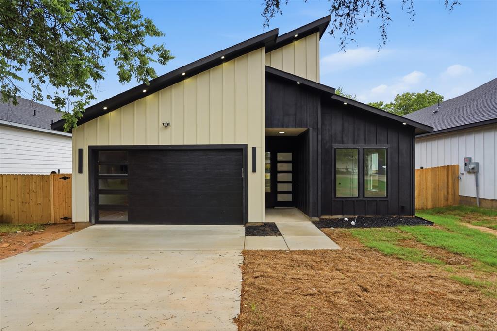 1111 Riverwood Road Dallas, TX 75217 - Photo 2 of 40 Modern exterior featuring black and cream vertical siding