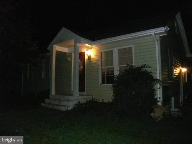 12220 Selfridge Road Silver Spring, MD 20906 - Photo 2 of 3 a front view of a house with garden