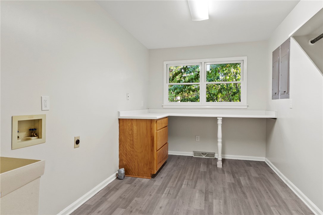 225 Arrowhead Trail Easley, SC 29642 - Photo 24 of 33 This spacious utility area features ample counter space, bright window views, and durable flooring for everyday tasks.
