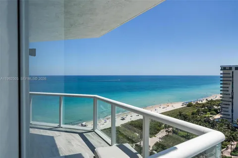 a view of a balcony with ocean view