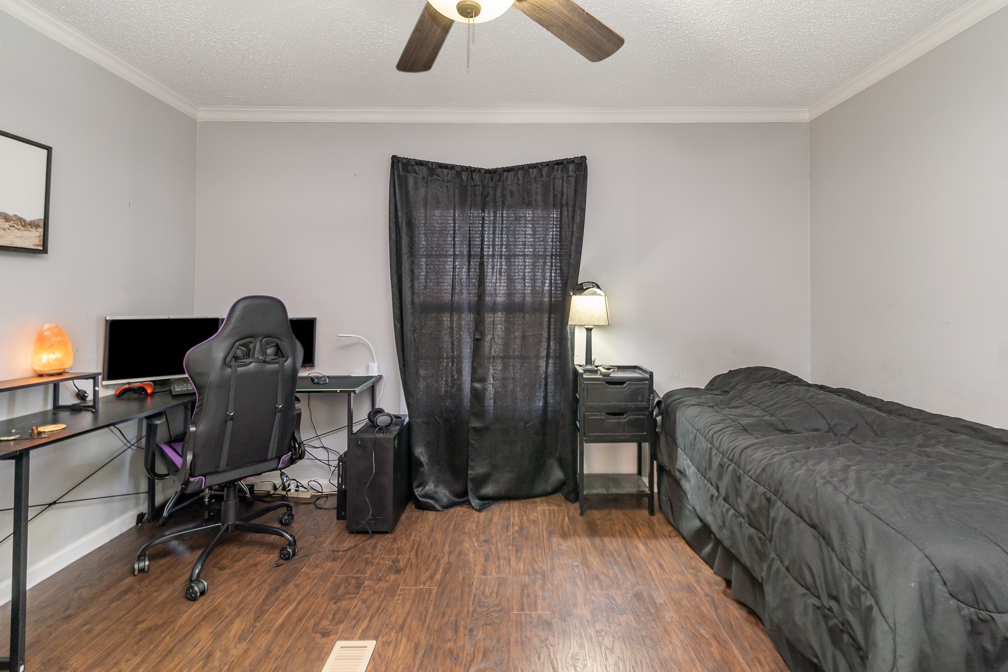 7801 Bob Carr Road Cross Plains, TN 37049 - Photo 25 of 38 a bedroom with bed and a chandelier