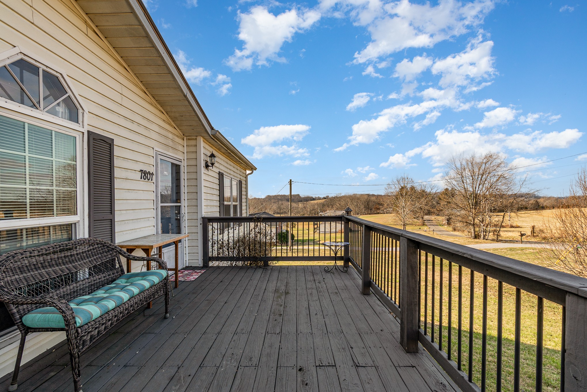 7801 Bob Carr Road Cross Plains, TN 37049 - Photo 34 of 38 a view of a balcony with wooden chairs