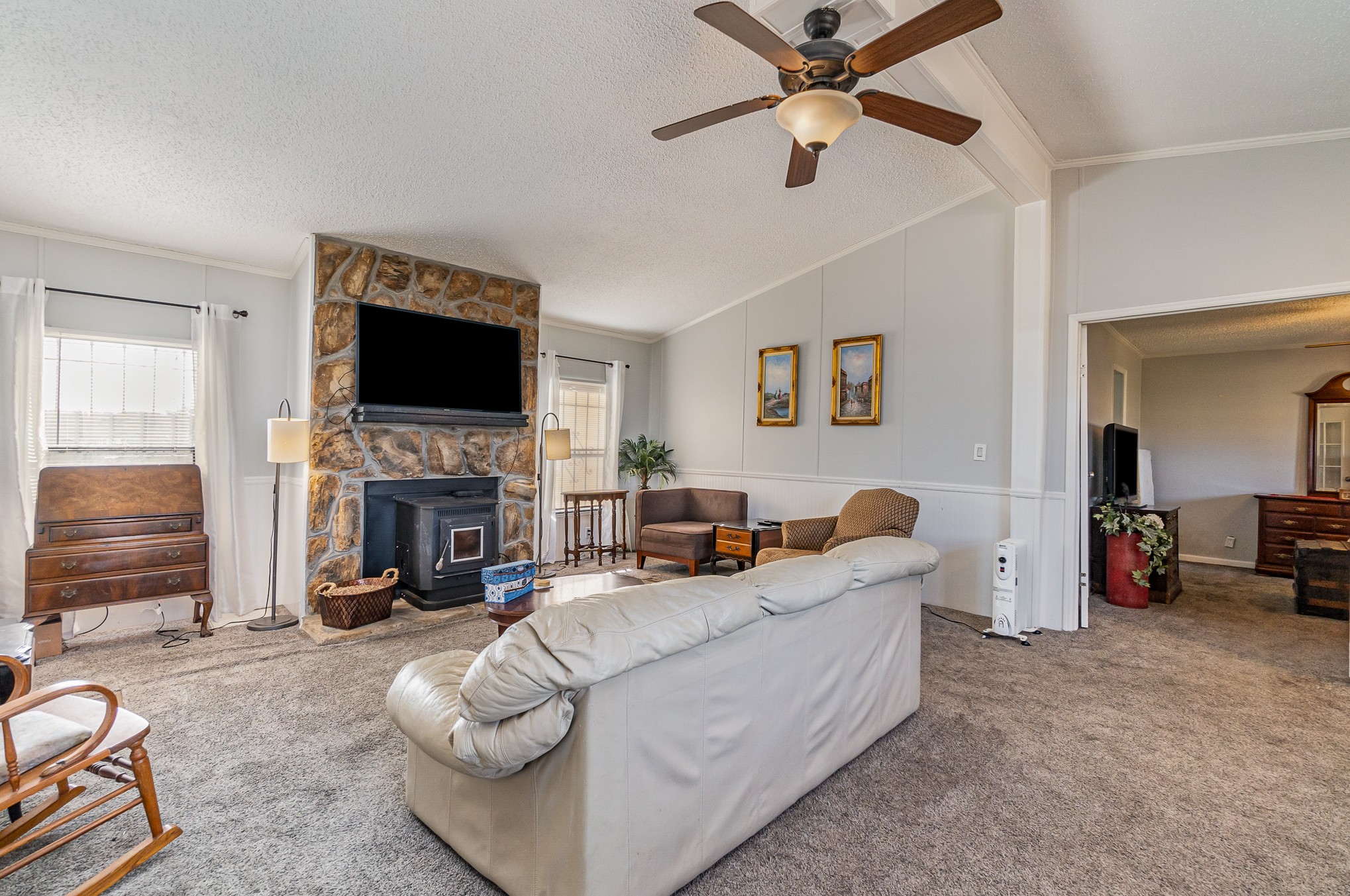 7801 Bob Carr Road Cross Plains, TN 37049 - Photo 9 of 38 a living room with furniture a fireplace and a flat screen tv