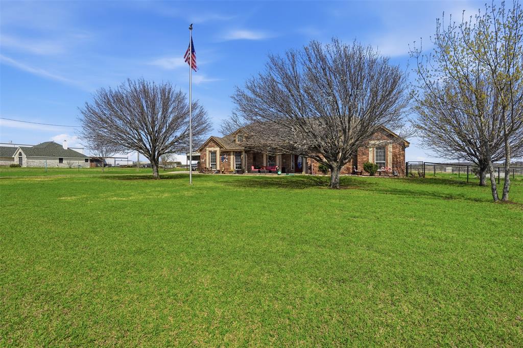 7229 County Road 1205 Rio Vista, TX 76093 - Photo 1 of 40 a view of a building with a big yard
