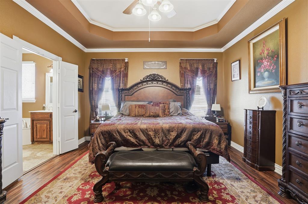 7229 County Road 1205 Rio Vista, TX 76093 - Photo 11 of 40 a bedroom with a bed and wooden floor