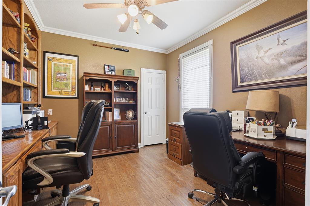 7229 County Road 1205 Rio Vista, TX 76093 - Photo 16 of 40 a view of a workspace with furniture and a window
