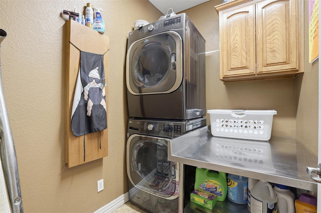 7229 County Road 1205 Rio Vista, TX 76093 - Photo 17 of 40 a utility room with dryer and washer