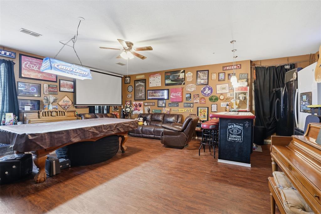 7229 County Road 1205 Rio Vista, TX 76093 - Photo 23 of 40 a living room with lots of furniture and kitchen view