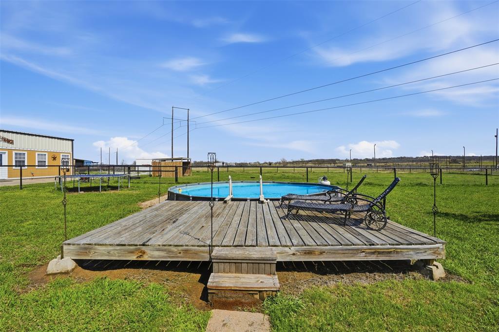 7229 County Road 1205 Rio Vista, TX 76093 - Photo 26 of 40 a view of a backyard with sitting area