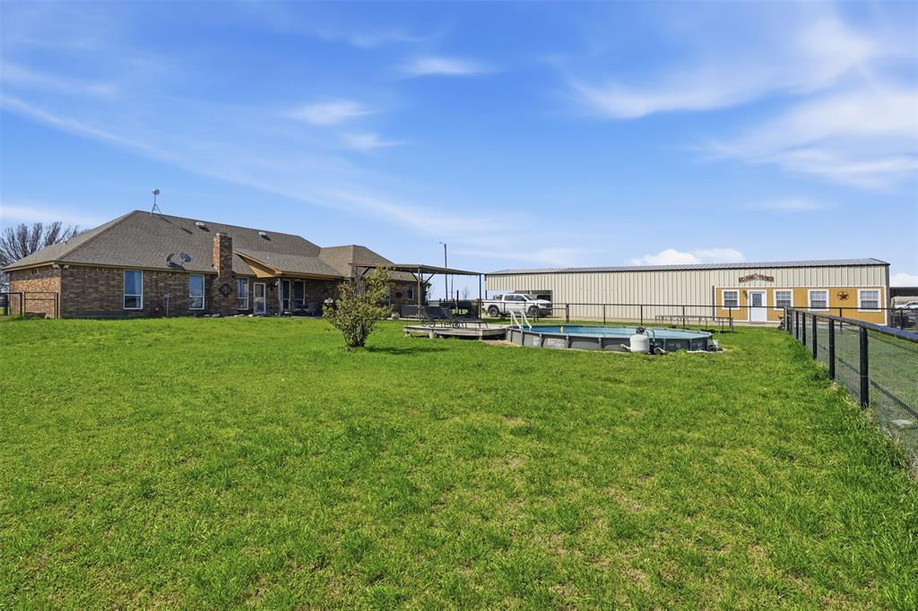 7229 County Road 1205 Rio Vista, TX 76093 - Photo 28 of 40 a view of a house with a big yard
