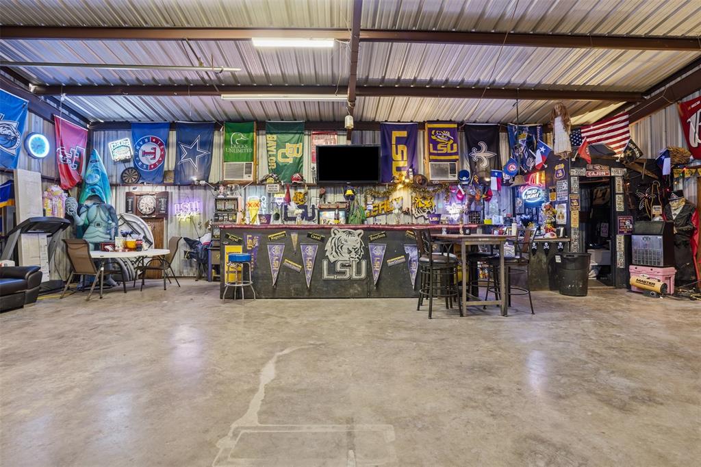 7229 County Road 1205 Rio Vista, TX 76093 - Photo 31 of 40 a view of group of people sitting in front of a store