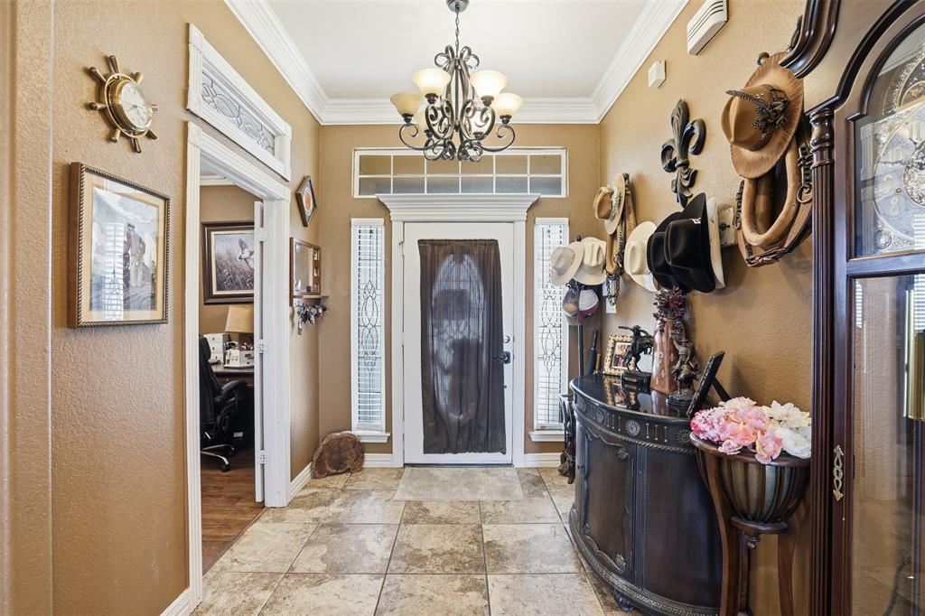7229 County Road 1205 Rio Vista, TX 76093 - Photo 5 of 40 a view of a entryway and chandelier