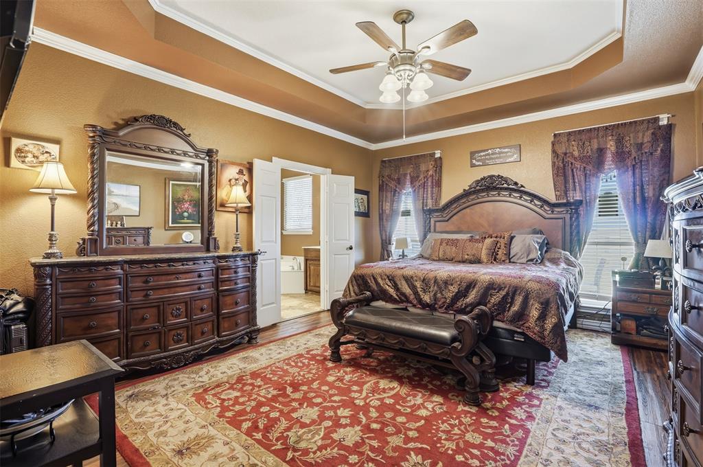 7229 County Road 1205 Rio Vista, TX 76093 - Photo 10 of 40 a bedroom with a bed and wooden floor