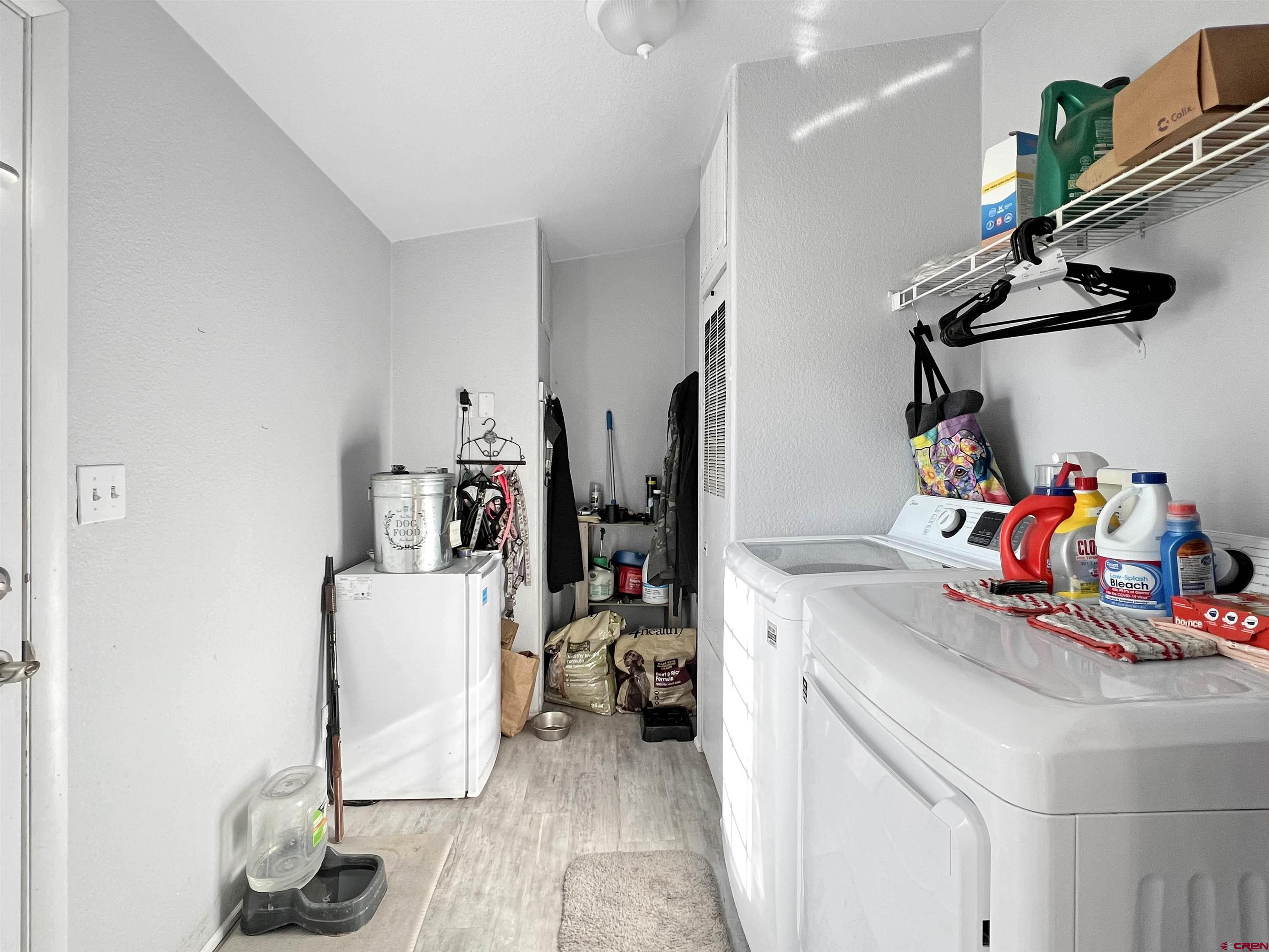 635 Fox Court Delta, CO 81416 - Photo 14 of 22 a view of a kitchen with fridge and workspace