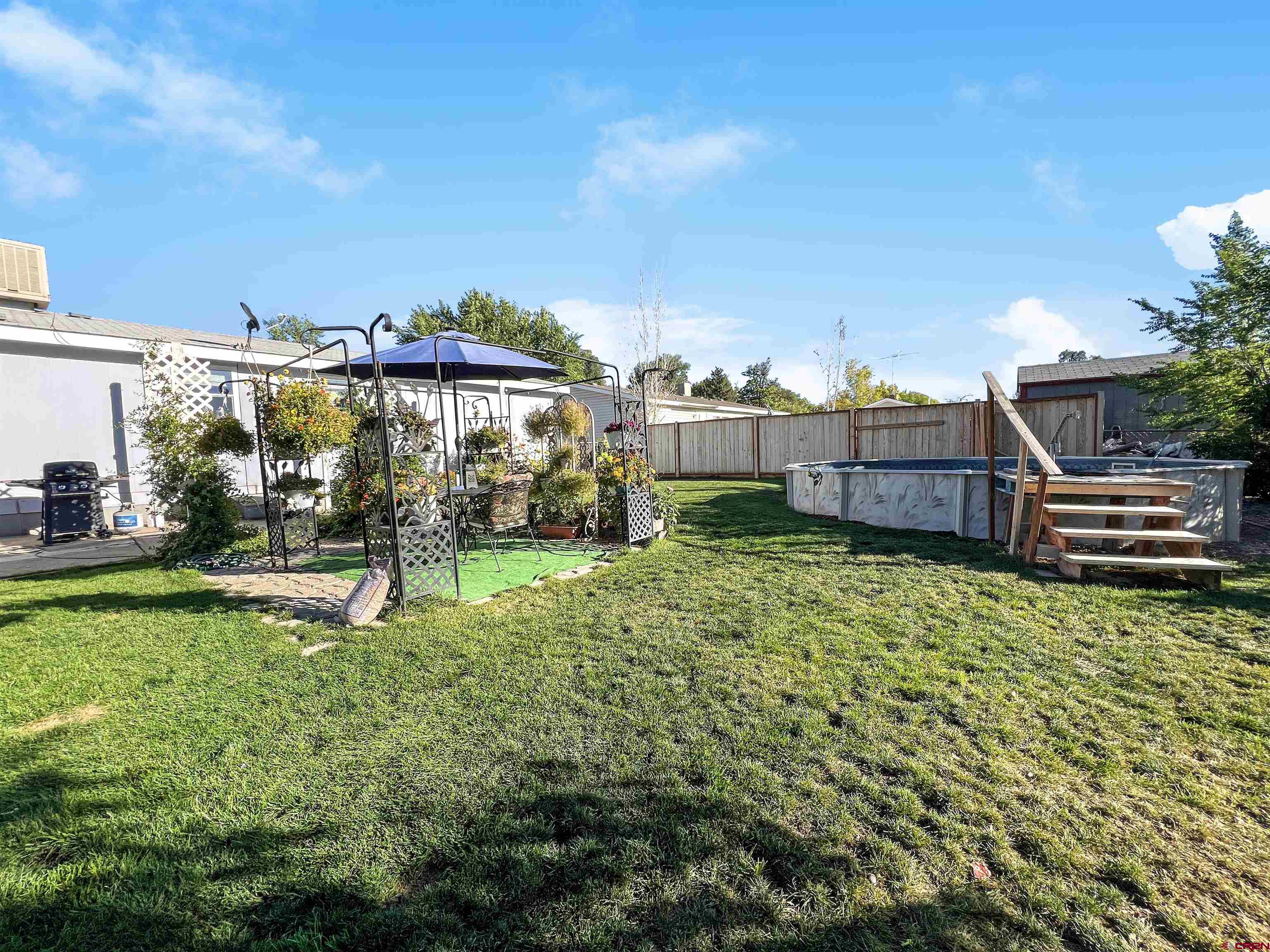 635 Fox Court Delta, CO 81416 - Photo 17 of 22 a view of a house with backyard and sitting area