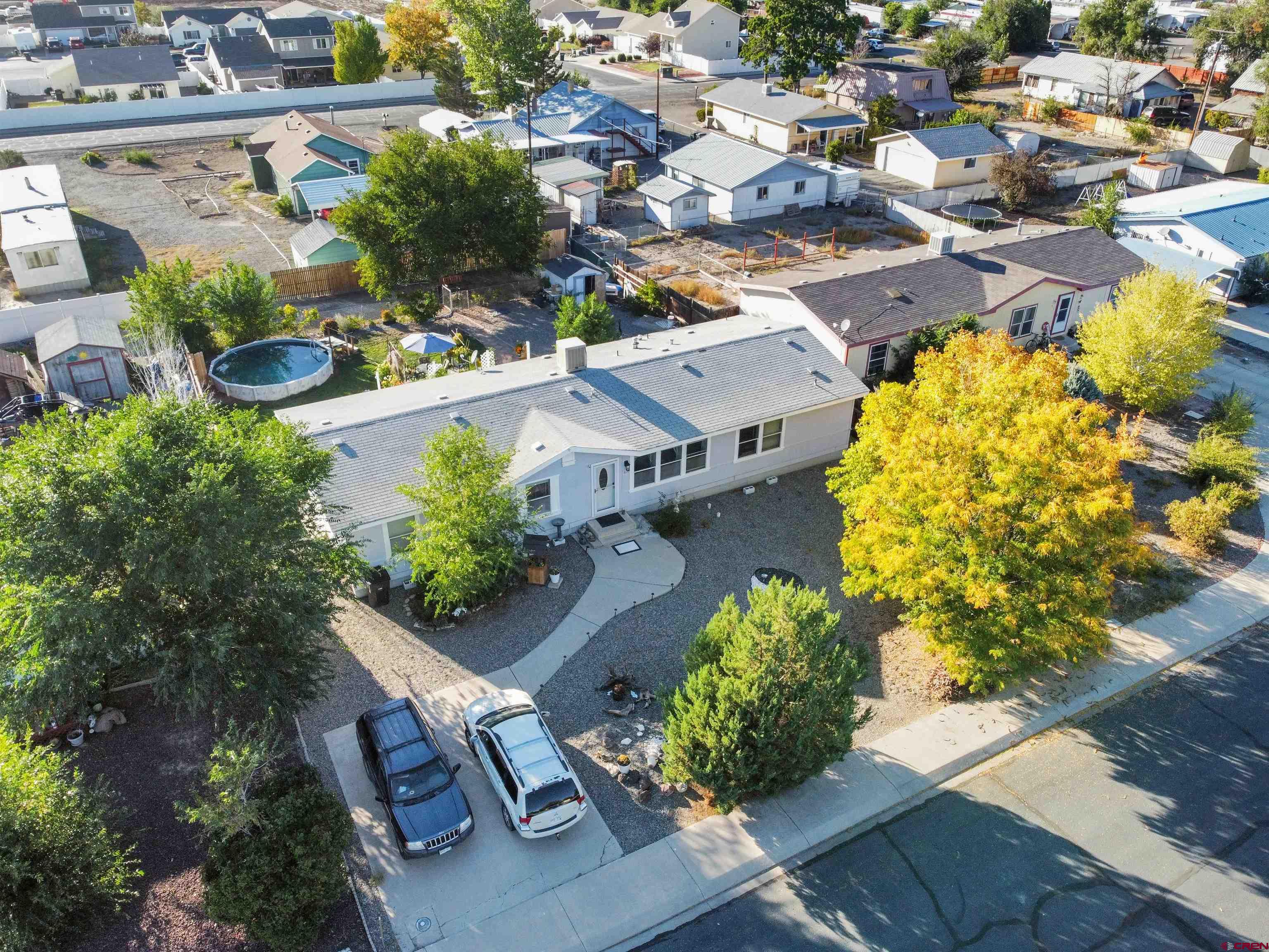 635 Fox Court Delta, CO 81416 - Photo 22 of 22 an aerial view of a house with a yard and garden