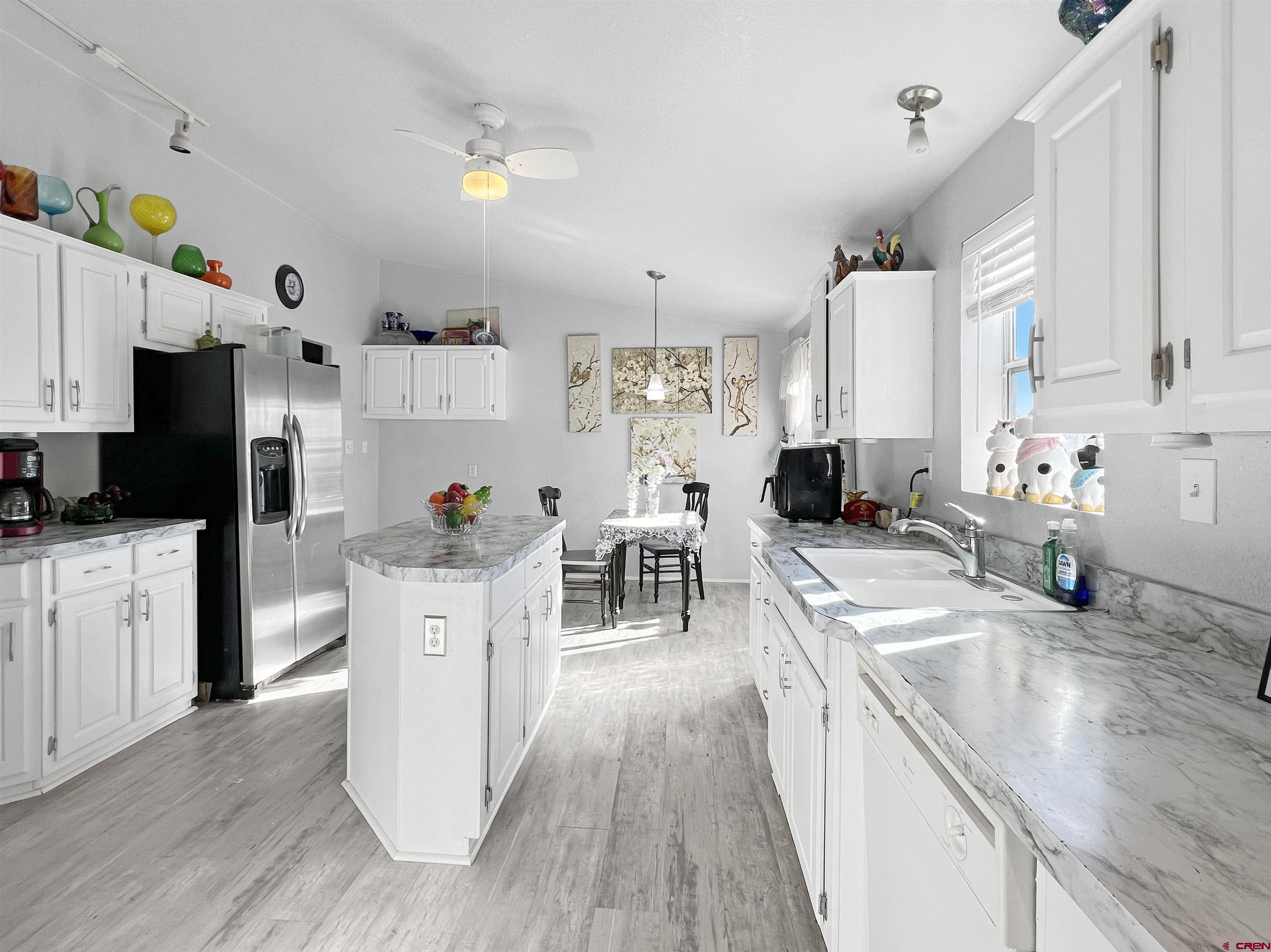 635 Fox Court Delta, CO 81416 - Photo 8 of 22 a kitchen with a sink stove and cabinets
