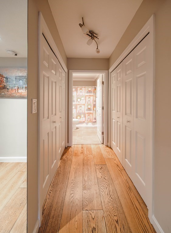 59 Brainerd Road, Unit 407 Boston, MA 02134 - Photo 16 of 22 a view of a room with wooden floor and windows