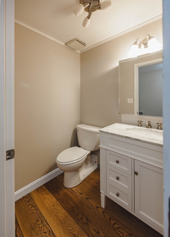 59 Brainerd Road, Unit 407 Boston, MA 02134 - Photo 18 of 22 a bathroom with a toilet a sink and mirror