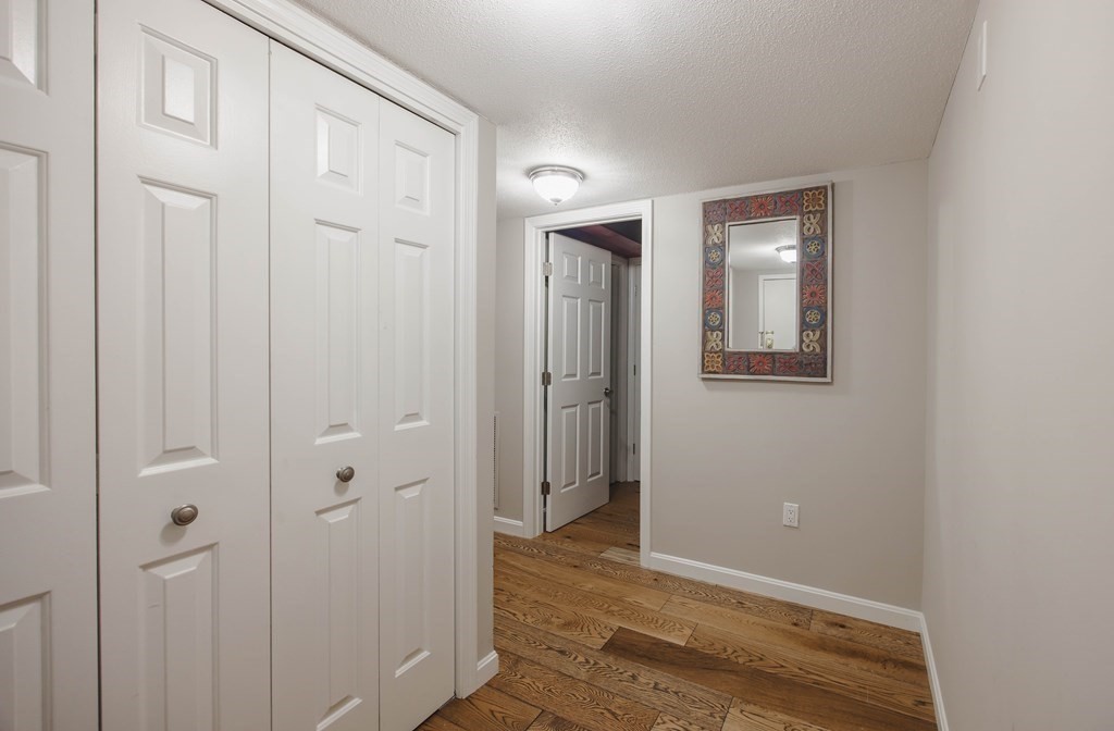 59 Brainerd Road, Unit 407 Boston, MA 02134 - Photo 4 of 22 wooden floor and closet in a room
