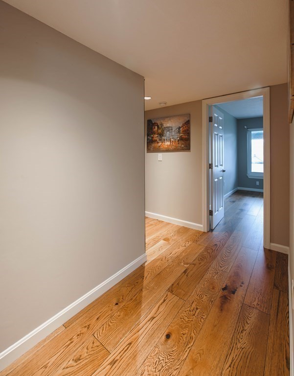 59 Brainerd Road, Unit 407 Boston, MA 02134 - Photo 5 of 22 wooden floor in an empty room