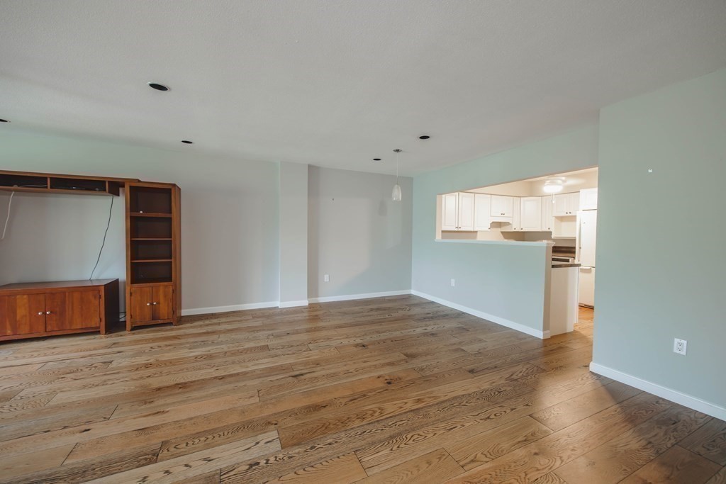 59 Brainerd Road, Unit 407 Boston, MA 02134 - Photo 7 of 22 a view of empty room with wooden floor
