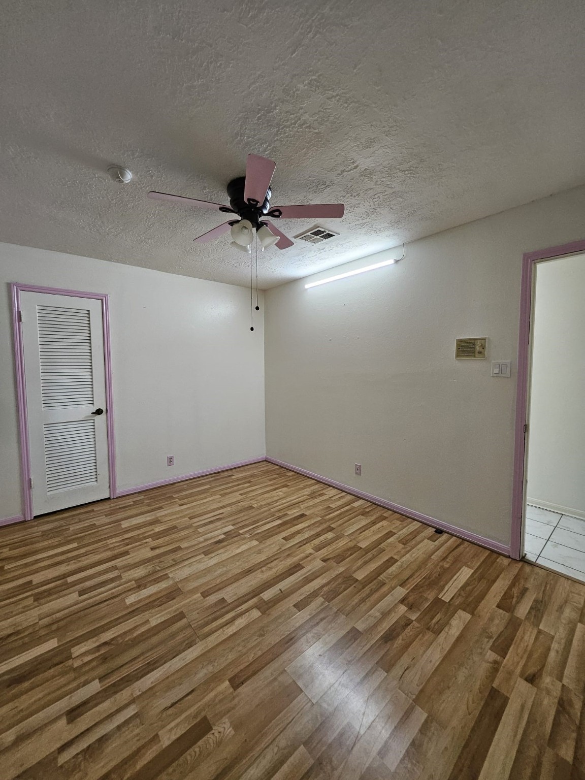 9415 Spellman Road Houston, TX 77031 - Photo 14 of 26 a view of an empty room and chandelier fan