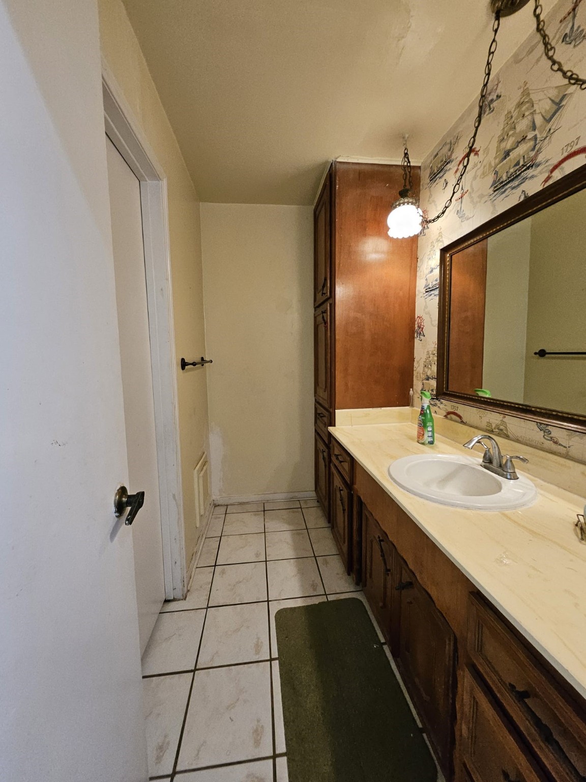 9415 Spellman Road Houston, TX 77031 - Photo 17 of 26 a spacious bathroom with a double vanity sink a mirror and a shower