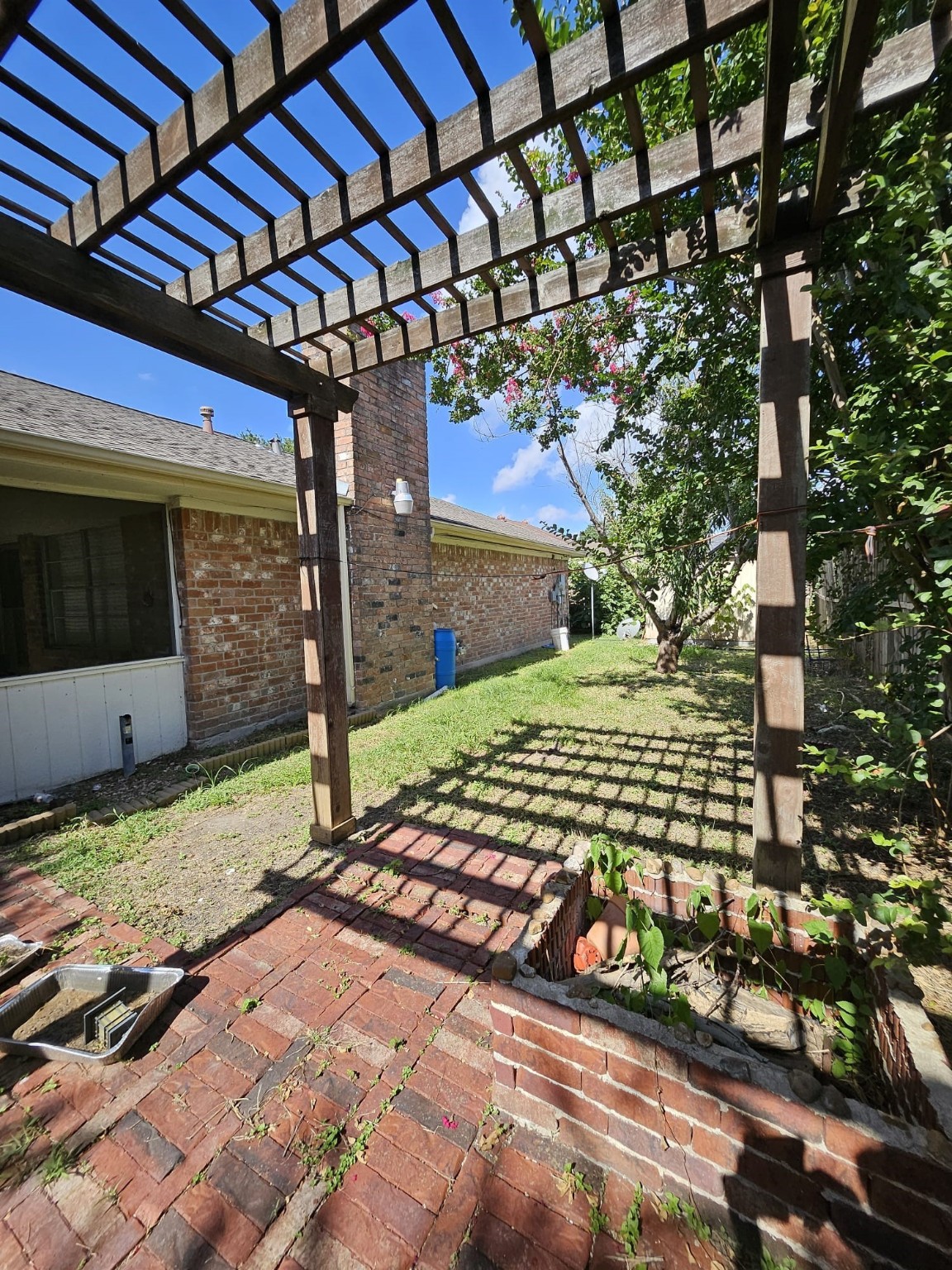 9415 Spellman Road Houston, TX 77031 - Photo 20 of 26 a view of a backyard with a tree