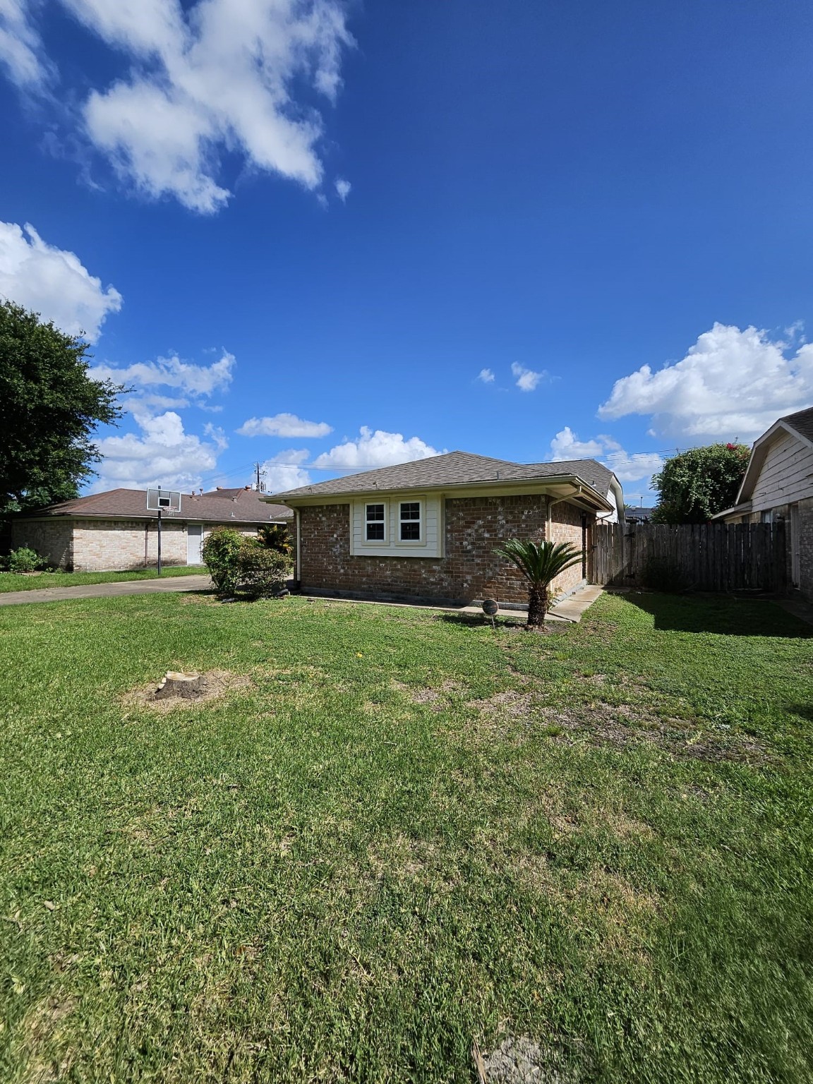 9415 Spellman Road Houston, TX 77031 - Photo 2 of 26 a front view of a house with a garden