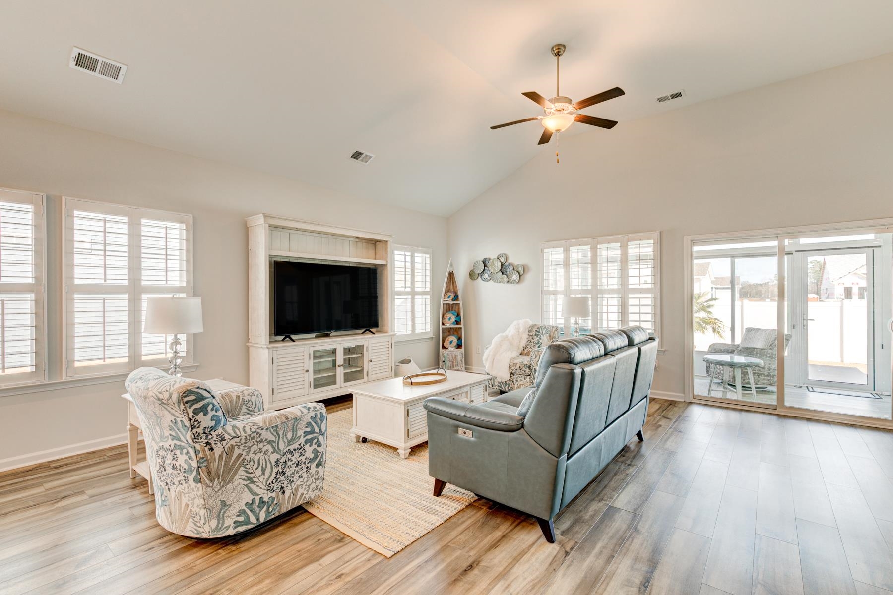 417 Heathside Street Murrells Inlet, SC 29576 - Photo 15 of 40 Living room featuring light wood finished floors, a ceiling fan, and high vaulted ceiling