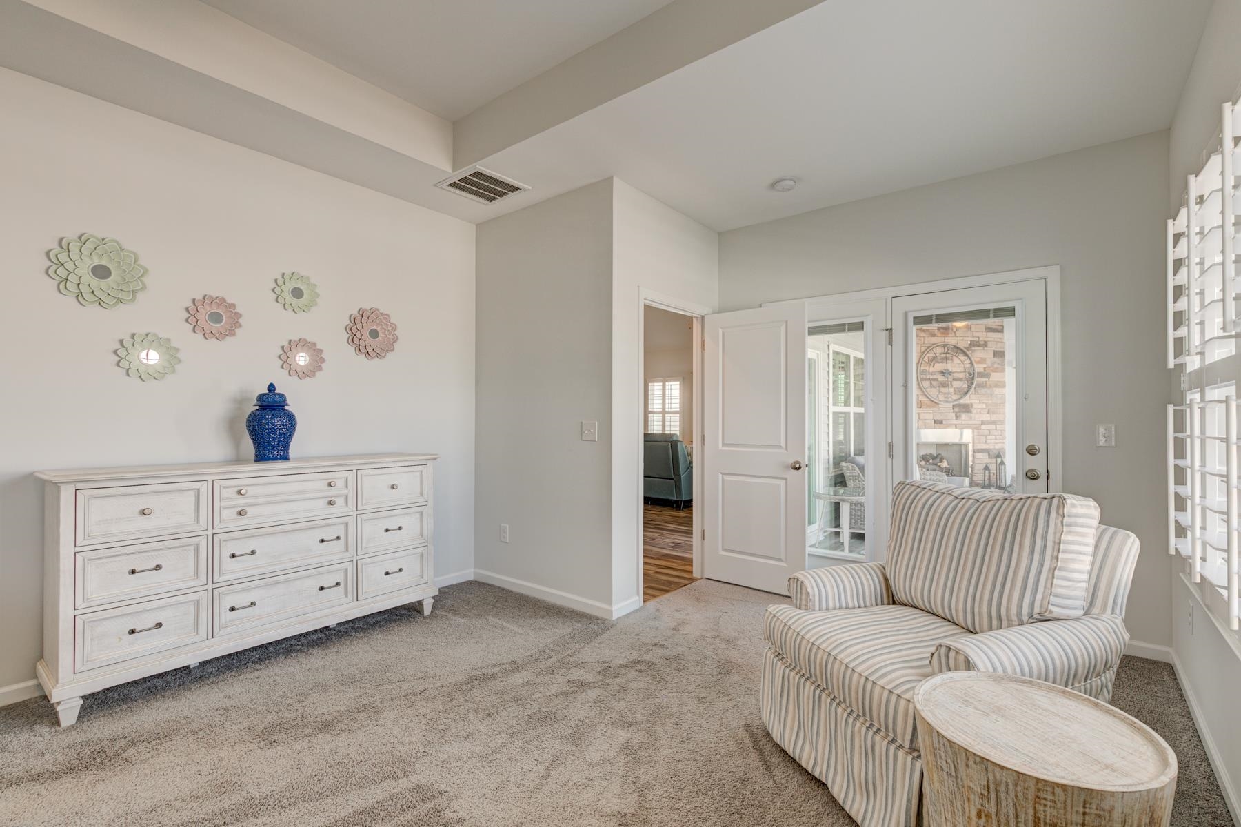 417 Heathside Street Murrells Inlet, SC 29576 - Photo 17 of 40 Living area with light colored carpet and baseboards
