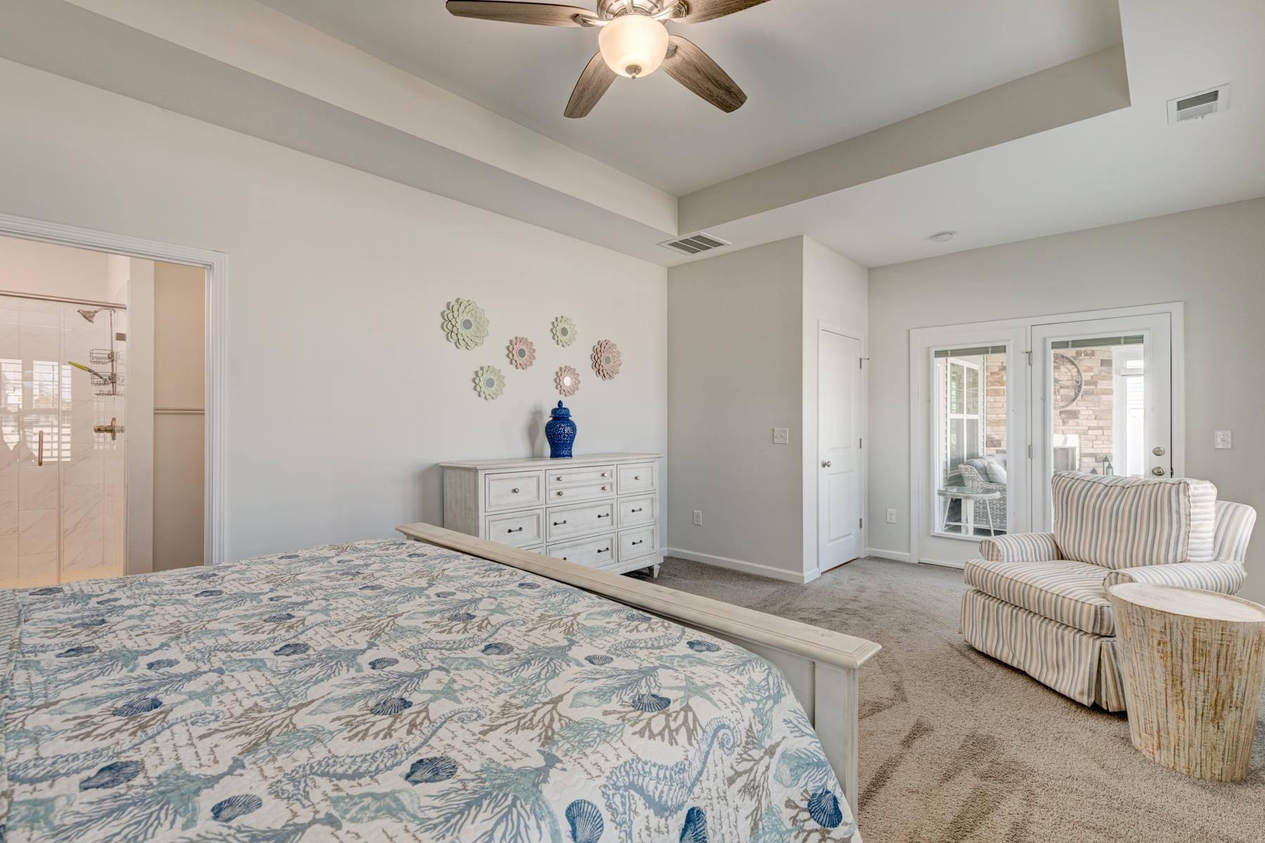 417 Heathside Street Murrells Inlet, SC 29576 - Photo 19 of 40 Bedroom featuring a tray ceiling, carpet floors, access to exterior, and ceiling fan