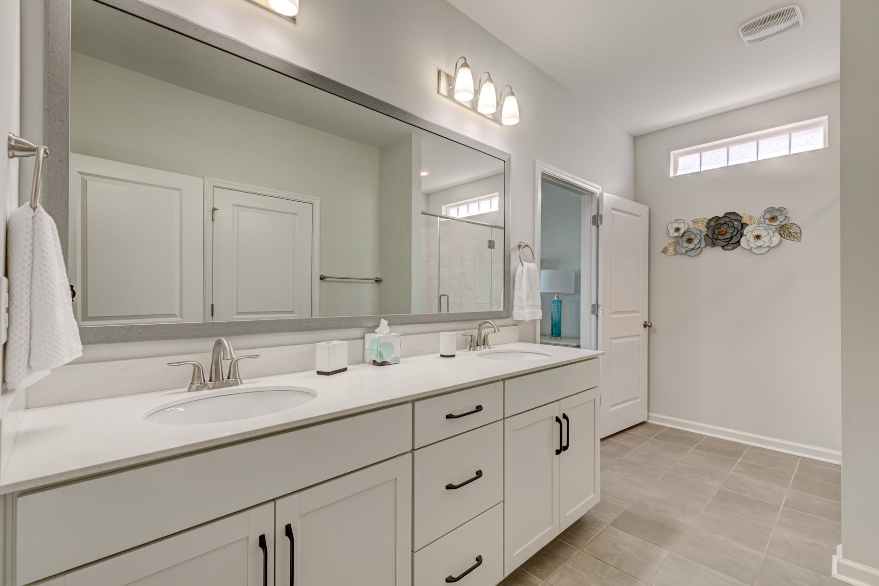 417 Heathside Street Murrells Inlet, SC 29576 - Photo 24 of 40 Full bathroom featuring a shower stall and double vanity