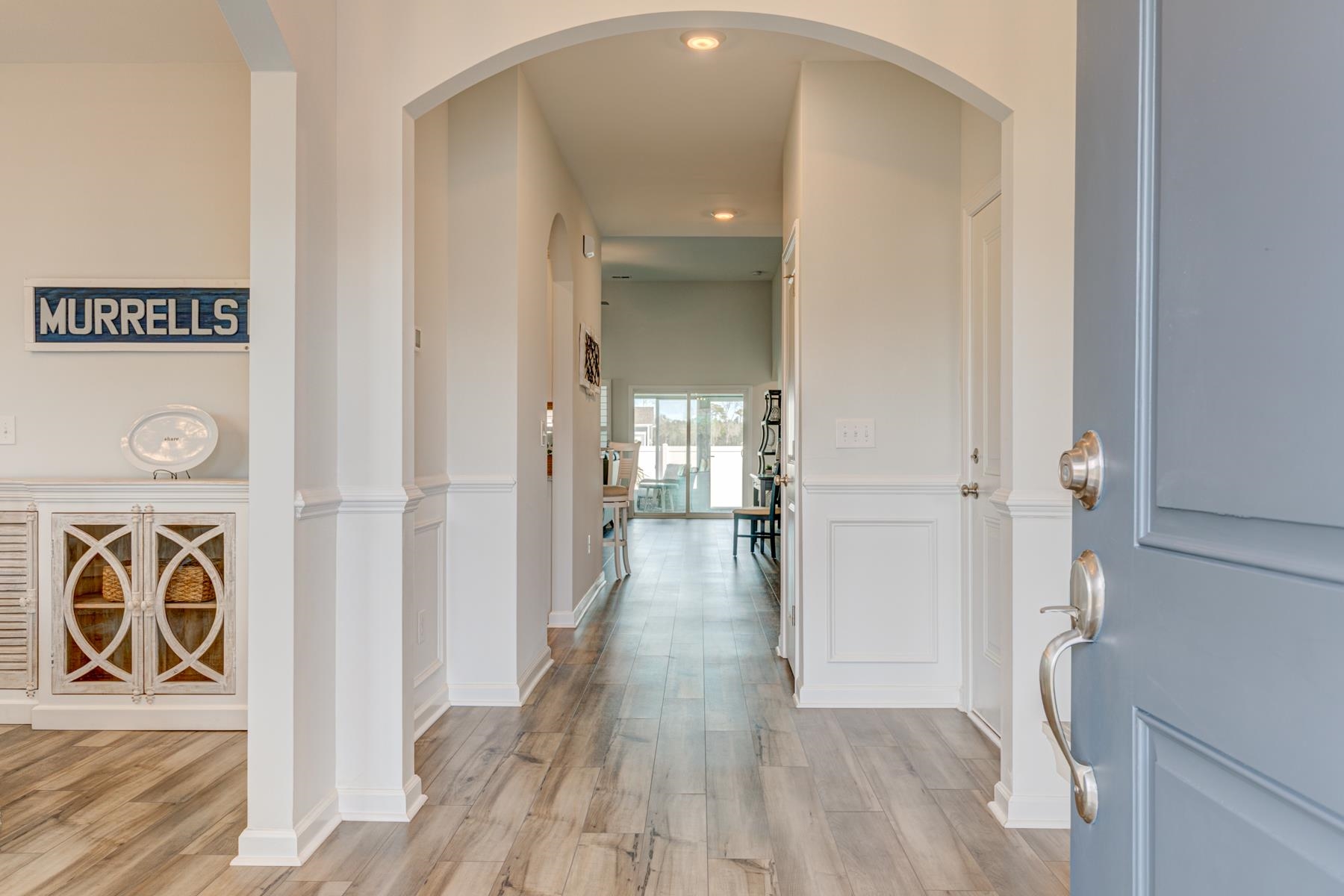 417 Heathside Street Murrells Inlet, SC 29576 - Photo 3 of 40 Hall with light wood finished floors and arched walkways