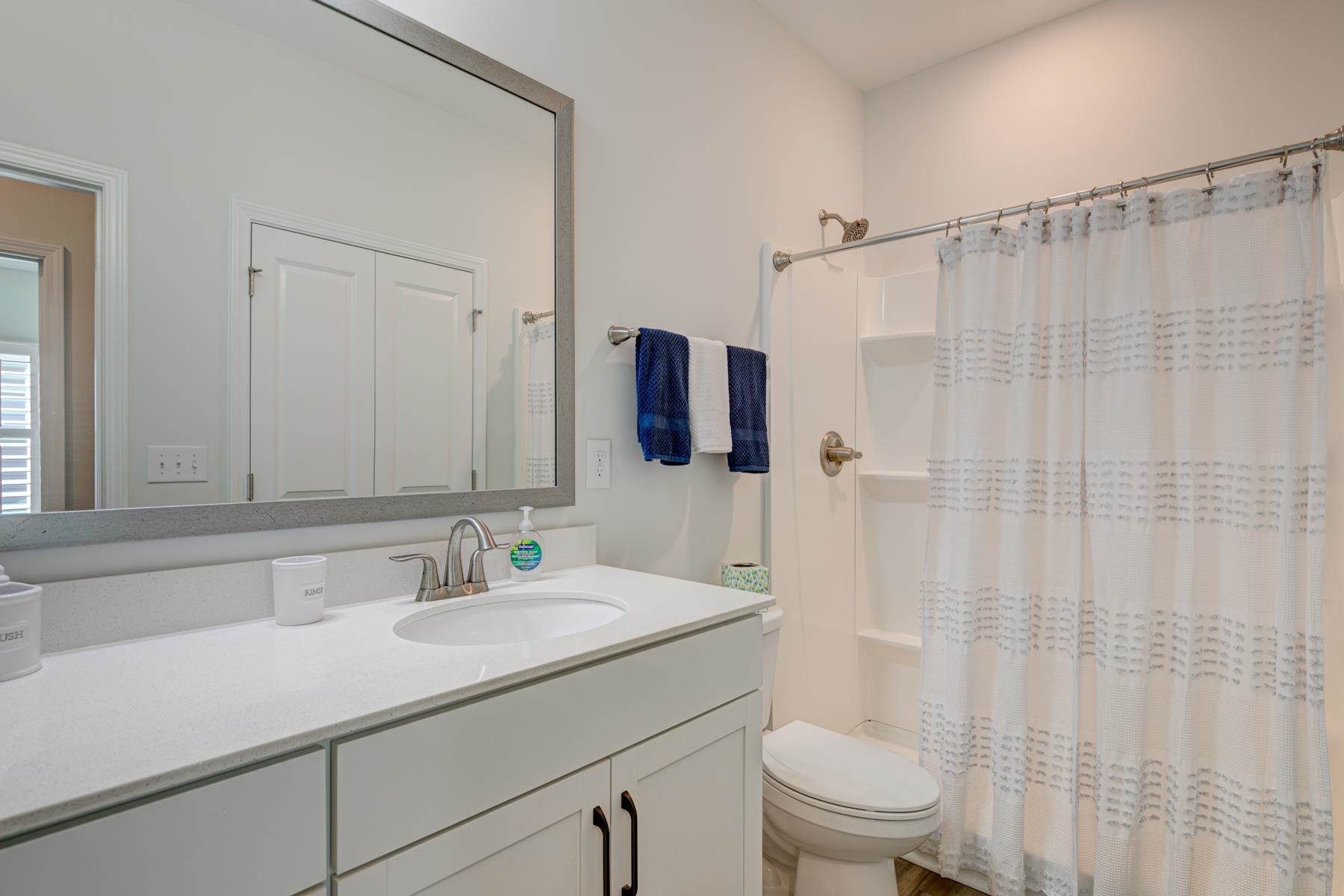 417 Heathside Street Murrells Inlet, SC 29576 - Photo 30 of 40 Bathroom featuring curtained shower and vanity