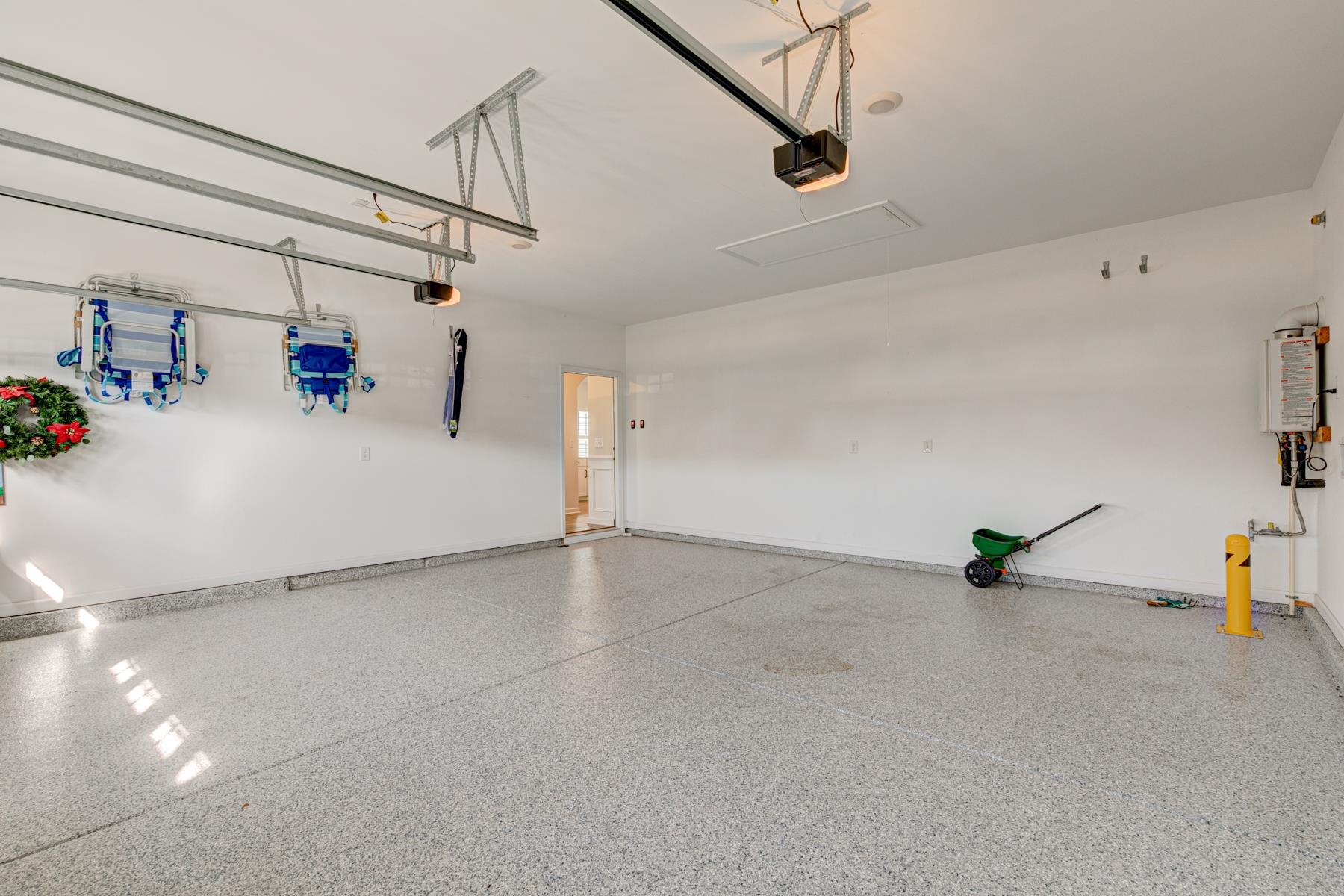 417 Heathside Street Murrells Inlet, SC 29576 - Photo 39 of 40 Garage with a garage door opener and tankless water heater