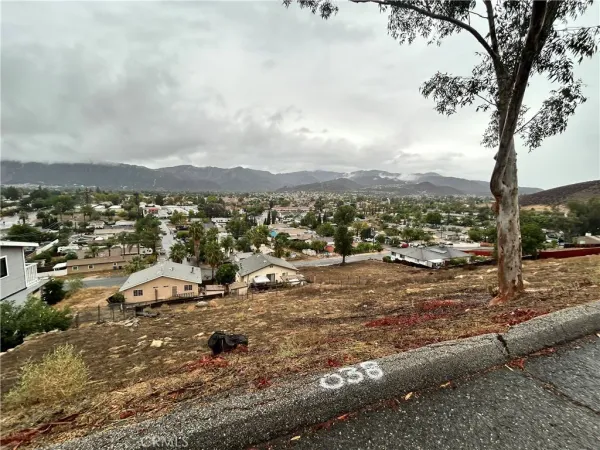 a view of a town with mountains in the background