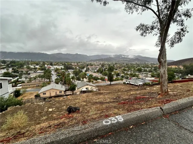 a view of a town with mountains in the background