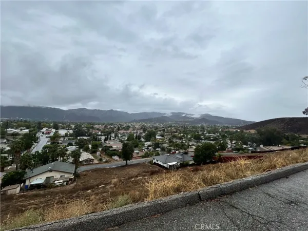 an aerial view of residential building and trees around