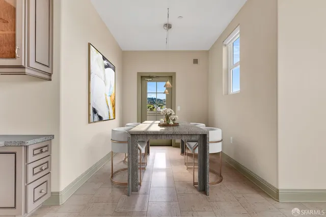 a view of kitchen with stainless steel appliances granite countertop refrigerator sink and cabinets