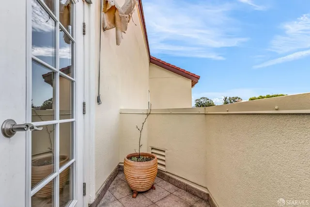 a kitchen with refrigerator and cabinets