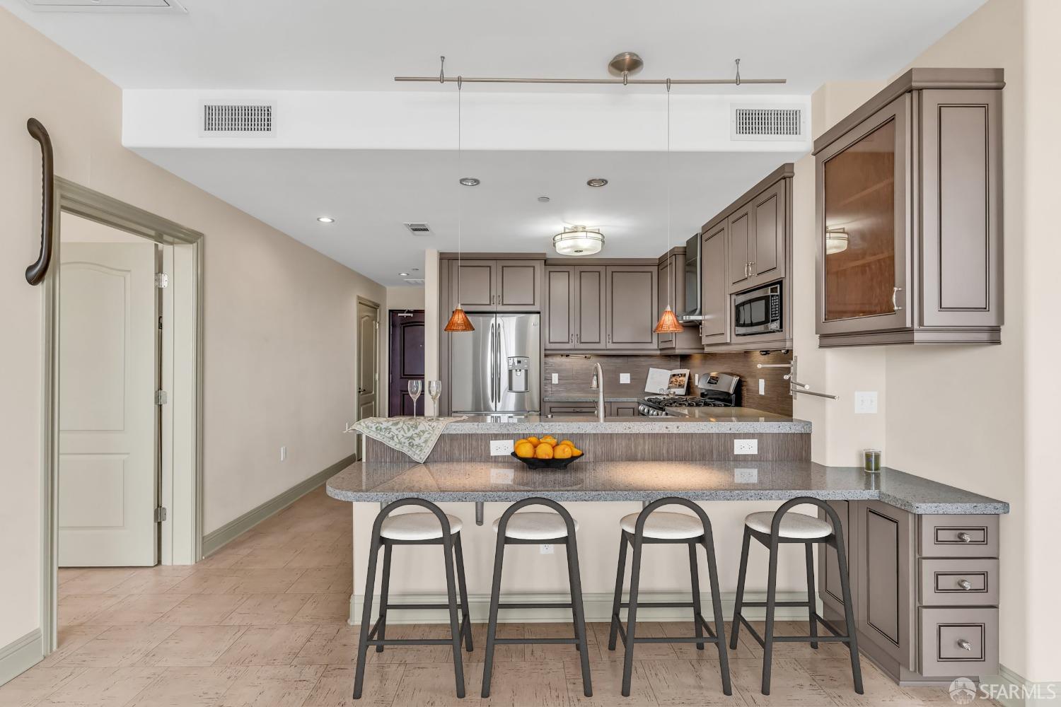 151 El Camino Real, Unit 402 Millbrae, CA 94030 - Photo 19 of 43 a kitchen with refrigerator and cabinets