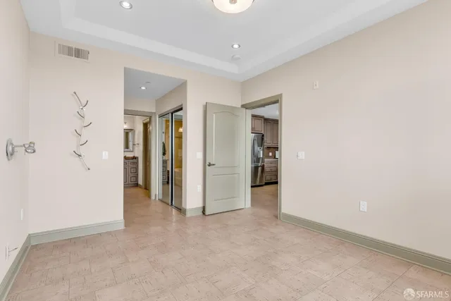 a view of walk in closet with white walls