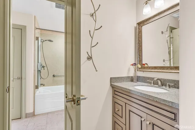 a view of a hallway to room with stair
