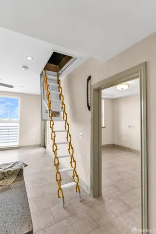 a view of front door with staircase