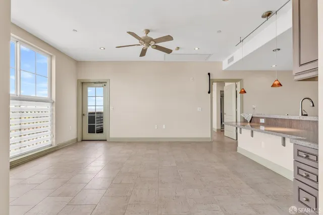 a view of a livingroom with a kitchen