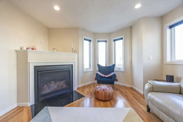 a bathroom with a granite countertop toilet sink and mirror