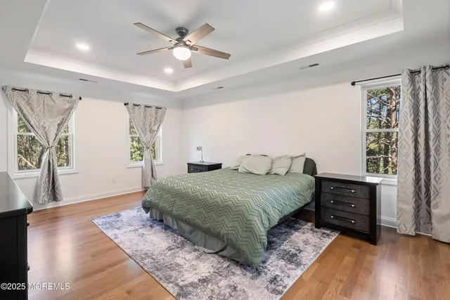 a spacious bedroom with a large bed and a window